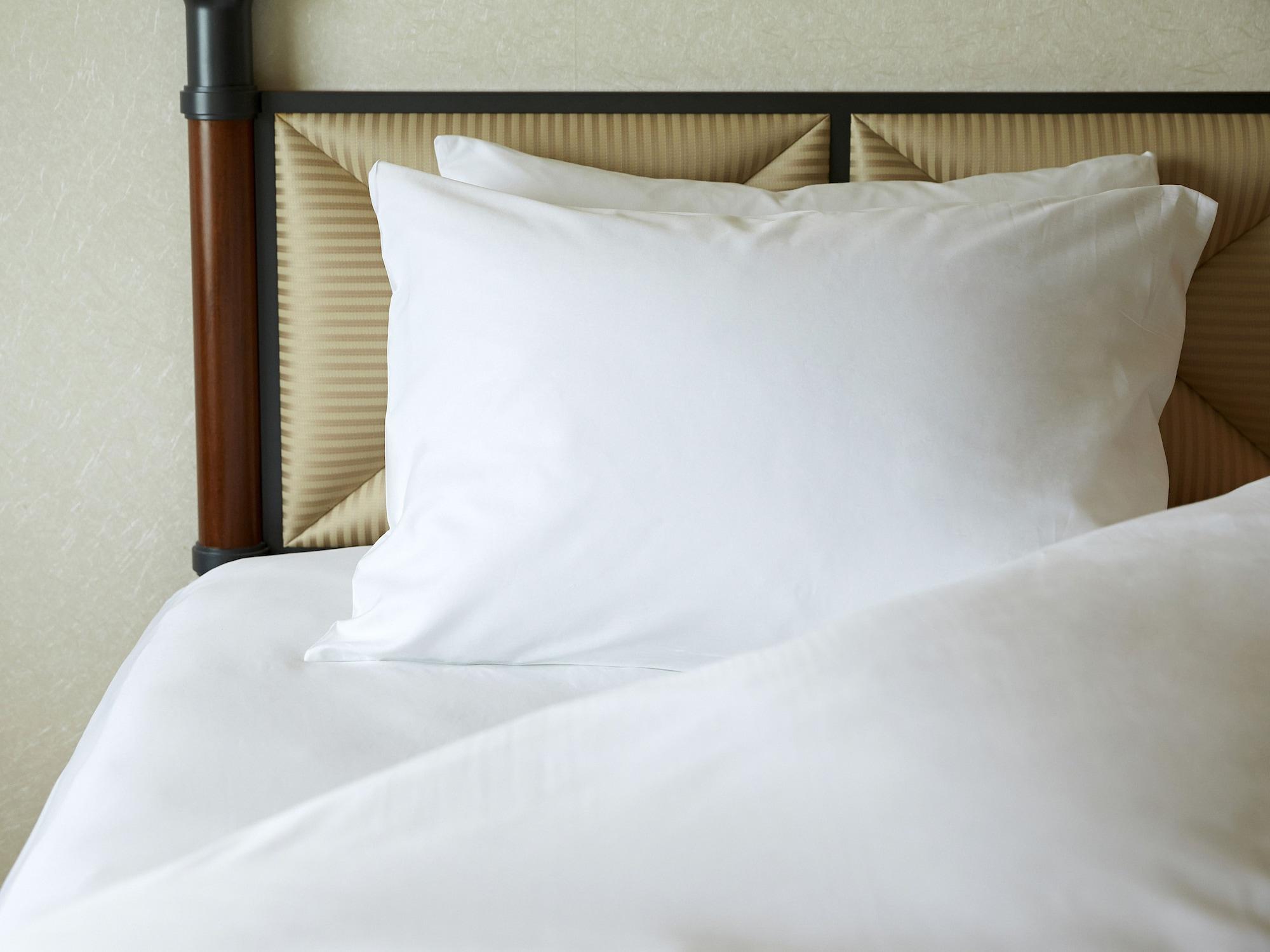 Miyako Hotel Gifu Nagaragawa Exterior foto A pillow on a bed